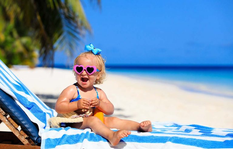 child-on-beach-in-tropical-sun