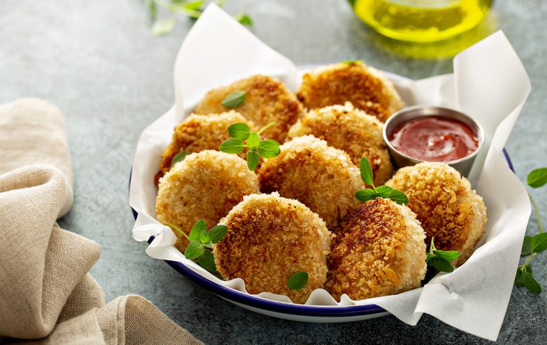 Cooked fish patties in bowl