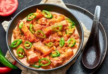 How to Prepare Bicol Express, a Filipino Spicy Stew Black bowl on a table containing Bicol Express stew